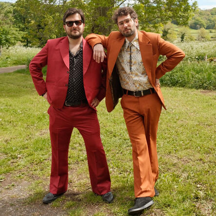 Weddings The Gastric Band in red and orange flared suits